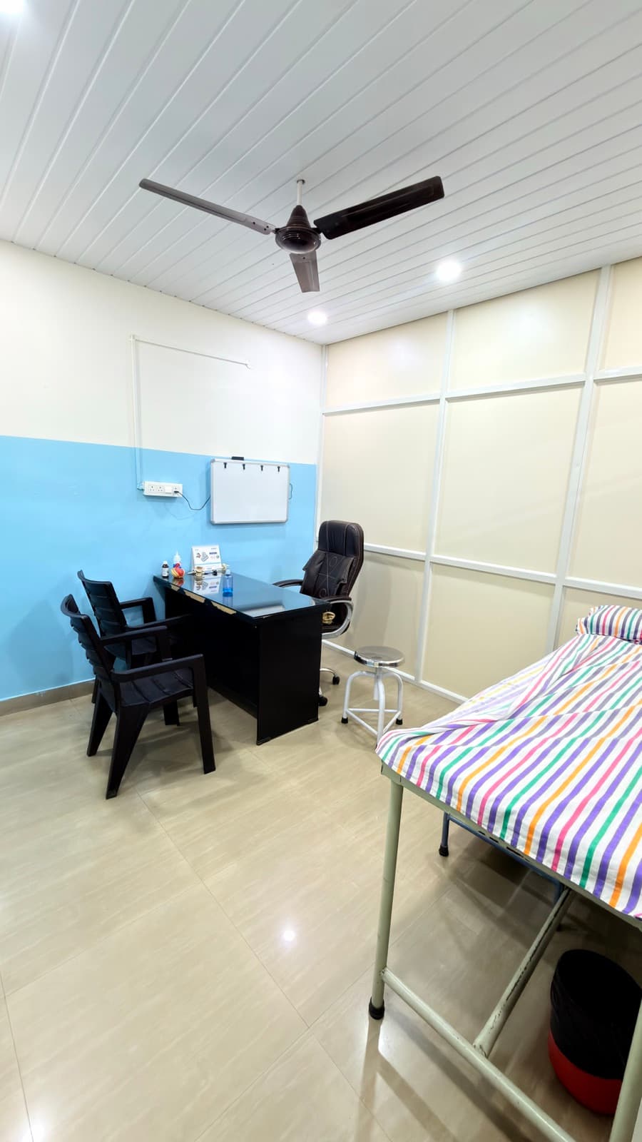 A second consulting room, kept for the visiting specialists.